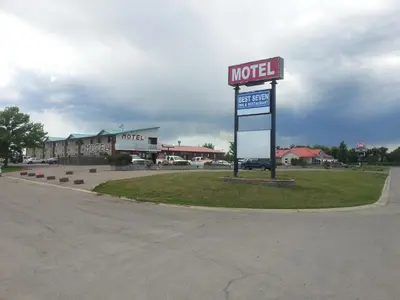 a motel sign on the side of a road at Best Seven Inn in Claresholm