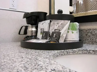 a counter top with a coffee pot on a counter at Hampton Inn by Hilton Fort Saskatchewan in Fort Saskatchewan