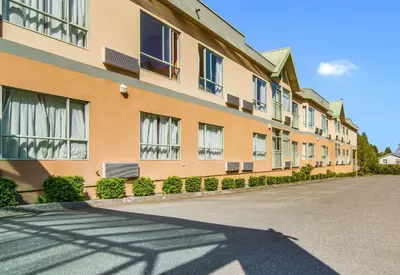 an empty street in front of a building at Motel 6 Surrey, Bc in Surrey