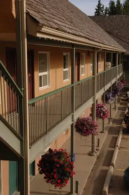 a row of houses with flowers on the balconies at Lakeview Inns & Suites - Hinton in Hinton