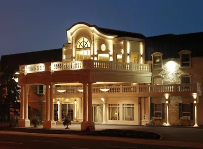 a large building with a balcony on top of it at Chateau Louis Hotel & Conference Centre in Edmonton