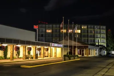 a hotel with christmas lights in front of a building at Coast Discovery Inn in Campbell River