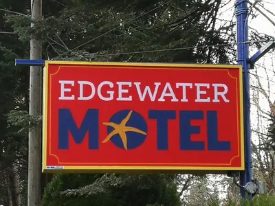 a sign for a watermed sign on a pole at Edgewater Motel in Oyster Bay