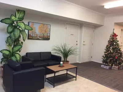 a living room with a christmas tree and a couch at Cactus Tree Inn in Oliver