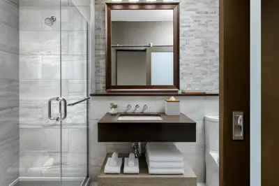 a bathroom with a sink and a mirror at The Josie Hotel, Autograph Collection in Rossland