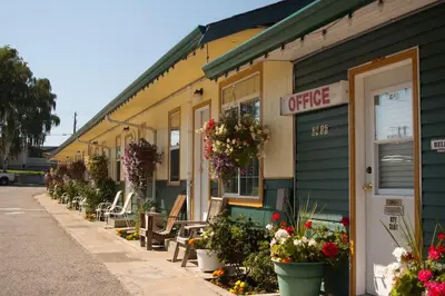 a store with flowers and plants outside of it at Boundary Motel in Osoyoos