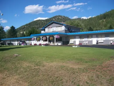 a large building with a lawn in front of it at Evening Star Motel in Greenwood