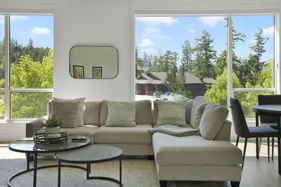 a living room with a couch and a table at Predator Ridge Resort in Vernon
