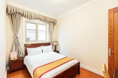a bedroom with a bed and a window at An Yang House in Burnaby