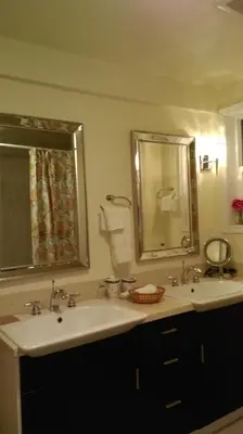 a bathroom with two sinks and a mirror at Gabriola Central B&B in Gabriola