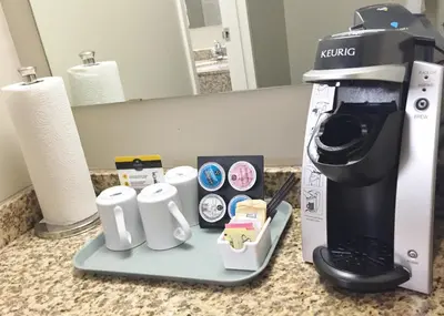 a coffee maker sitting on top of a counter at BCMInns - Lloydminster in Lloydminster