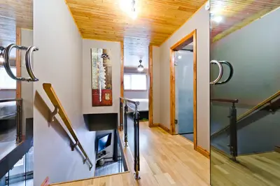 a staircase in a house with wooden ceilings at M Lofts in Calgary
