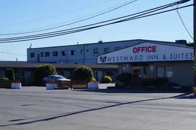 an office sign in front of a building at Westward Inn & Suites in Langley