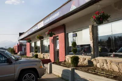 a car parked in front of a restaurant at Valemount Vacation Inn in Valemount