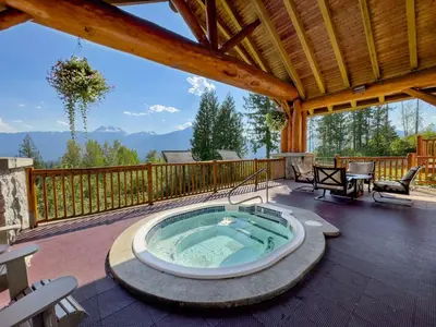 a hot tub on the deck of a cabin at Coast Hillcrest Hotel in Revelstoke