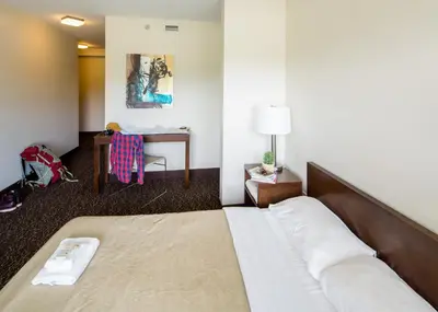 a hotel room with a bed and a desk at HI Whistler - Hostel in Whistler
