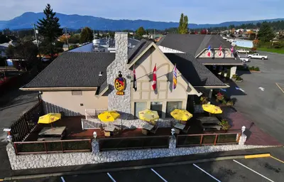 an aerial view of a building with umbrellas at The Hospitality Inn in Port Alberni