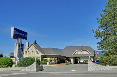 a building with a sign in the middle of a street at The Hospitality Inn in Port Alberni
