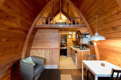 a kitchen and living room of a log cabin at Backeddy Resort and Marina in Egmont