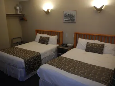 a hotel room with two beds in a room at Fernie Slopeside Lodge in Fernie