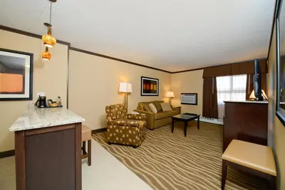 a hotel room with a living room at Siding 16 Lodge in Wetaskiwin