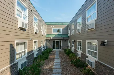 a walkway between two buildings at Days Inn by Wyndham Valemount in Valemount