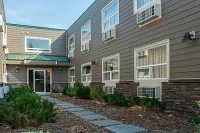 a house with a pathway in front of it at Days Inn by Wyndham Valemount in Valemount