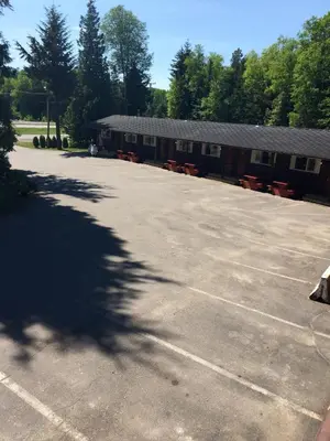 a parking lot in front of a building at Copper River Motel in Terrace