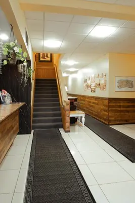 a hallway with a staircase in a building at Pemberton Hotel (Motel) in Pemberton