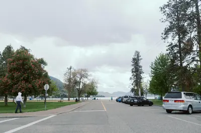 a street with cars parked on the side of the road at Waterfront Inn in Penticton