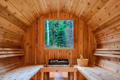 an inside view of a wooden cabin with a window at Winston Lodge in Golden