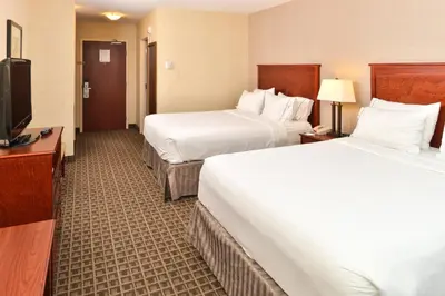 a hotel room with two beds and a flat screen tv at Holiday Inn Express Edmonton North by IHG in Edmonton