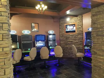 a video game room with a bunch of pinball machines at Twin Pine Inn & Suites in Hinton
