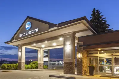 a best western building with a best western sign on it at Best Western Wayside Inn in Wetaskiwin