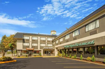 an empty parking lot in front of a building at Days Inn by Wyndham Terrace in Terrace