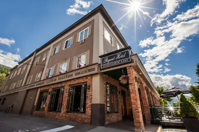 a building with a sign on the front of it at Regent Hotel Revelstoke in Revelstoke