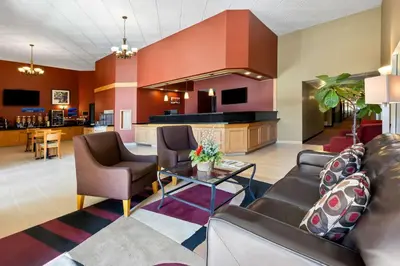 a living room with a couch and chairs at Best Western of Olds in Olds
