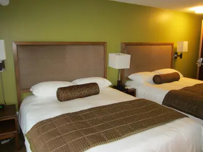 a hotel room with two beds in a room at Inn on the Harbour in Prince Rupert