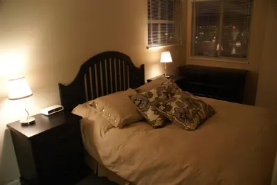 a bed with two pillows on it in a bedroom at Whistler Superior Properties in Whistler
