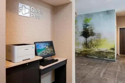 a computer sitting on a desk in a office at Courtyard by Marriott Prince George in Prince George
