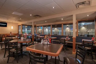 a dining room with tables and chairs in a restaurant at Sandman Hotel Revelstoke in Revelstoke
