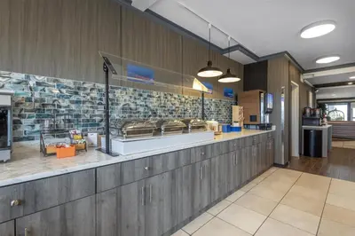 a fast food restaurant with a counter in a building at Best Western Dawson Creek in Dawson Creek