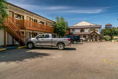 a silver truck parked in front of a building at Cedar Motel in Radium Hot Springs