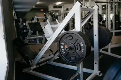 a barbell in a gym with other equipment at Ramada Golden in Golden