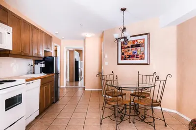 a kitchen with a table and chairs in a room at Mountain View Resort and Suites at Fairmont Hot Springs in Fairmont Hot Springs