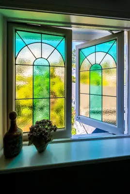 a window with a view of a garden through it at Crystal's View Bed & Breakfast in North Vancouver