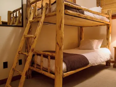 a bedroom with two bunk beds in a room at Snow Creek Cabins by Fernie Lodging Co in Fernie