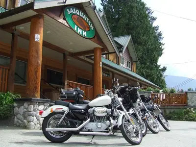 a row of motorcycles parked in front of a restaurant at Sasquatch Inn in Harrison Mills