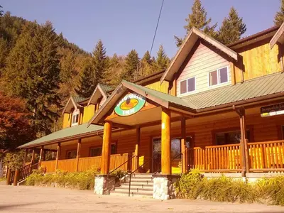 a large wooden house with a large at Sasquatch Inn in Harrison Mills