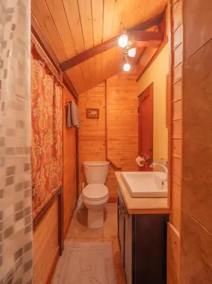 a bathroom with a toilet and a sink at Hillside Bungalows in Banff